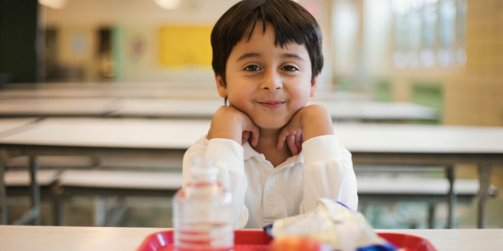 Boy at lunchroom table