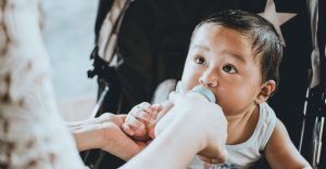 Baby nursing a bottle