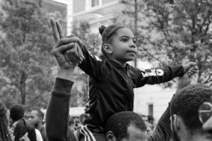 Girl on father's shoulders at BLM rally